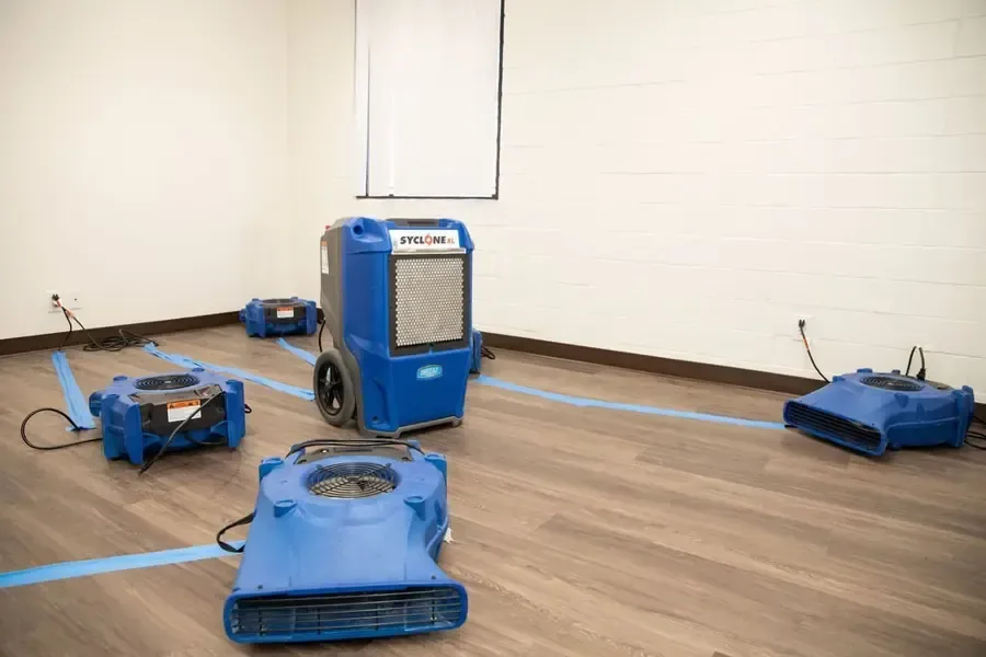 LGR dehumidifier and low-profile air movers drying out a room